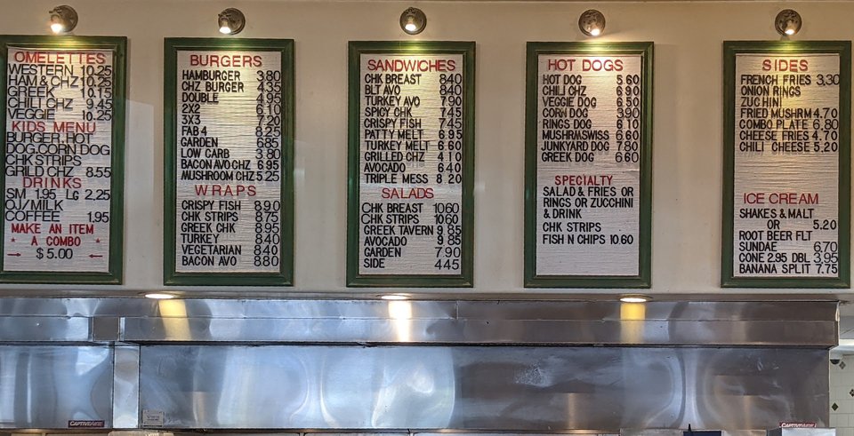 Casual diner counter with booths and warm lighting.